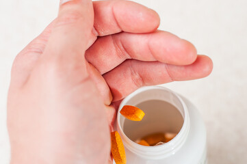 A dynamic photo where one tablet hits a jar and another flies past