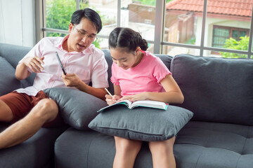 Happy family with father and daughter spending time together at home.