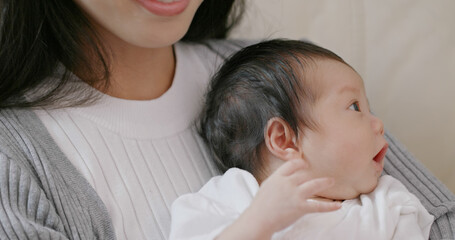 Mother touch on her baby back