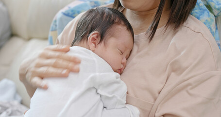 Mother touch on her baby back