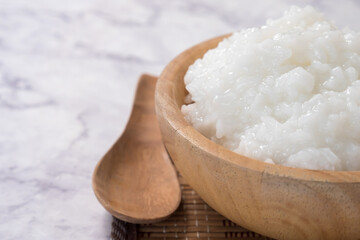 rice gruel or rice porridge in a wooden bowl.