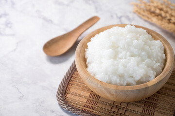 rice gruel or rice porridge in a wooden bowl.