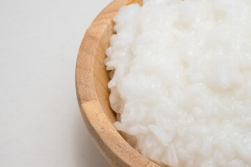 rice gruel or rice porridge in a wooden bowl.