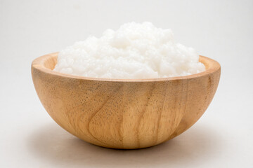 rice gruel or rice porridge in a wooden bowl.