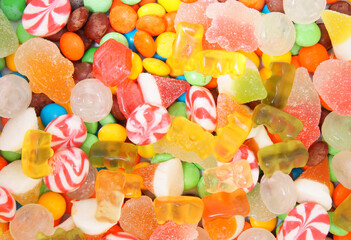 Fototapeta na wymiar Colorful fruit candies and jellies background