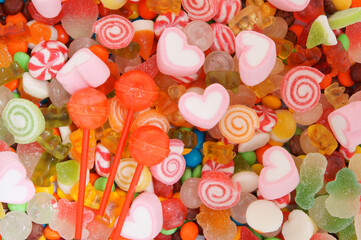 Mixed colorful fruit candies and marshmallow as background