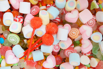 Mixed colorful fruit candies and jellies as background