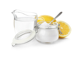 Baking soda, vinegar and lemon on white background