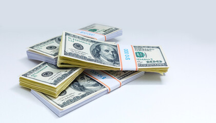 Set of a packs of dollars with a rubber band isolated on a white background