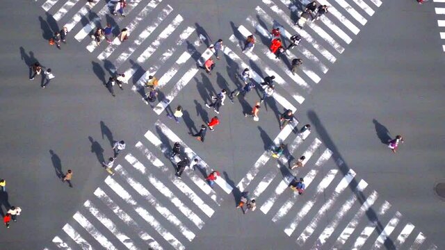 Ginza road intersection with crowd people and car in Tokyo, Japan