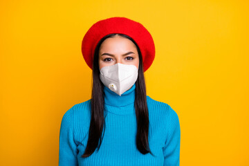 Close-up portrait of her she nice attractive healthy girl wearing respirator stop pathogen influenza pandemia china breath fresh air lungs care isolated bright yellow color background