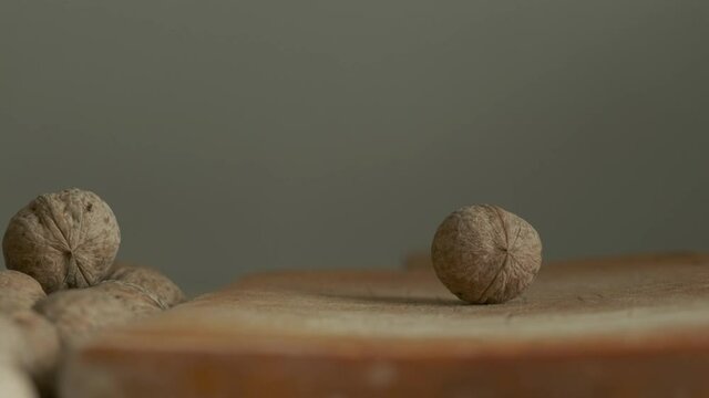 Crashing walnut with hammer close up view.