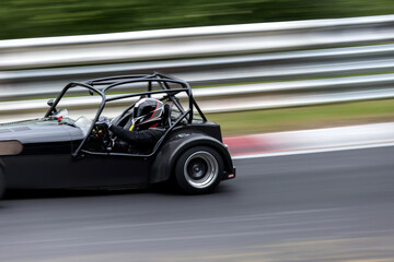a racing car speed blur on a race track