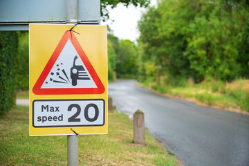 "Max speed 20" Temporary road sign on a village road with a out of focus background. Hertfordshire UK.