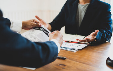 Businessmen are dissatisfied with the agreement and tear down the contract documents.