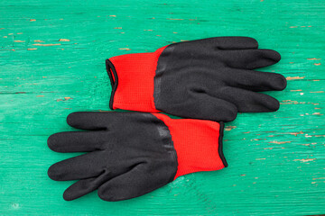 red gloves on black background