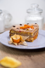 slice of cake with dried apricots on a purple delicate plate