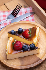 Fresh berries blueberries with Strawberry on top of the cheesecake