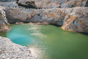 beautiful view of the quarry with a small lake in the middle