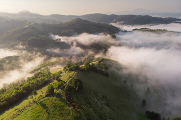 Aerial foggy landscape in Transylvania, at sunrise
