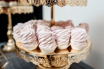 candy bar with sweet pink cupcakes