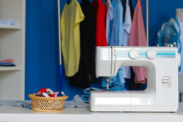 Electric sewing machine in a seamstress office