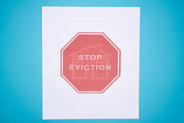 Concept of Tenants Stop Eviction signage printed on grunge textured paper.