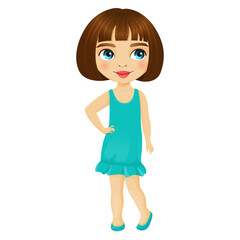 Cute little girl with dark hair and blue eyes stands in a turquoise dress