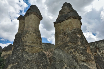The amazing landscape of Cappadocia. Against the background of the sky with picturesque clouds...