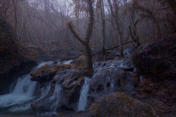Waterfalls amidst the fog in the winter