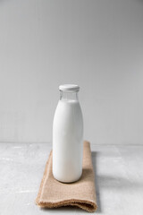 Bottle of milk on a net background, minimalism