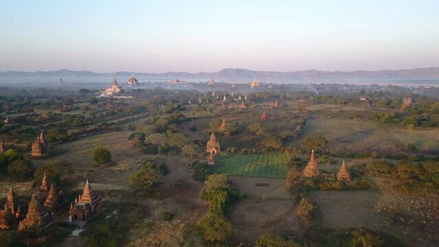 Aerial shot of the Bagan archeological site in Myanmar, overview of hundreds of pagodas and shrines .