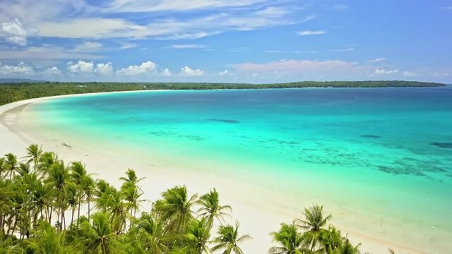 Backward flight over the Madwaer beach in the Kei Cecil island, Maluku, Indonesia
