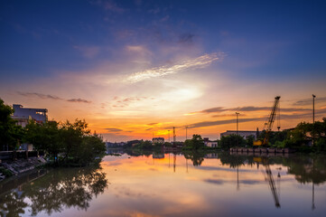 Hai Phong, Vietnam  Sep 2015 sunset at Tam Bac river bank with mirror water surface 