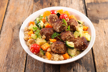 couscous with vegetables and meatballs in plate