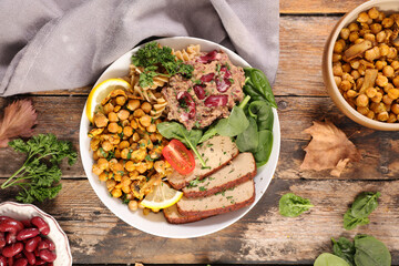 vegan salad bowl with tofu, chickpea, bean and spinach