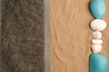 summer in the beach concept, cris towel on beach sand, on top of white and turquoise stones sand. beach sand .top view.
space for text - obrazy, fototapety, plakaty