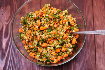 Salad of finely chopped vegetables - carrots, cabbage, cucumbers.