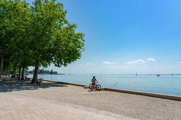 biker with her bicycle next to the Lake Balaton active holiday ride round lake