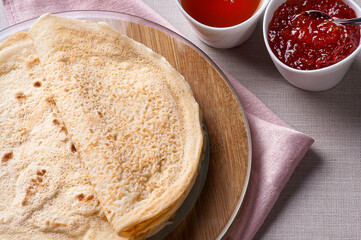 Traditional Russian Crepes Blini. Homemade thin pancakes. .Accompanied by jam and honey