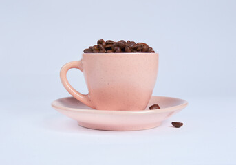 Coffee beans in a cup on a white background