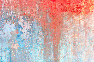 Old concrete wall covered with colorful paint