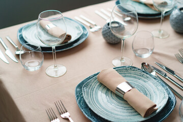 Luxury green table setting decorated with candles