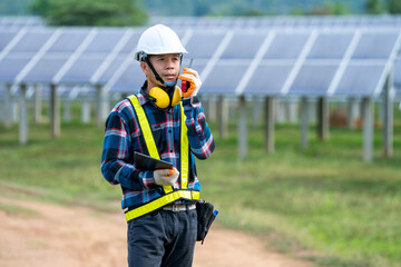 Engineer working on checking equipment in solar power plant,Climate change and renewable energy concept.