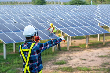 Engineer working on checking equipment in solar power plant,Climate change and renewable energy...
