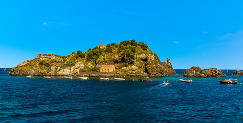 Fototapeta na wymiar The Isole dei Ciclopi island and stacks offshore Aci Trezza, Sicily in summer