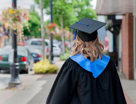 Young Recent School Graduate Walk S Down The Sidewalk