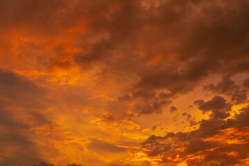 unusually beautiful fiery red tropical sunset. Burning clouds. Fire in the sky