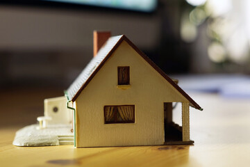 A close up photo of a miniature house - real estate concept