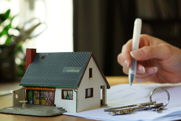 A person signing mortgage contract - buyin a property concept